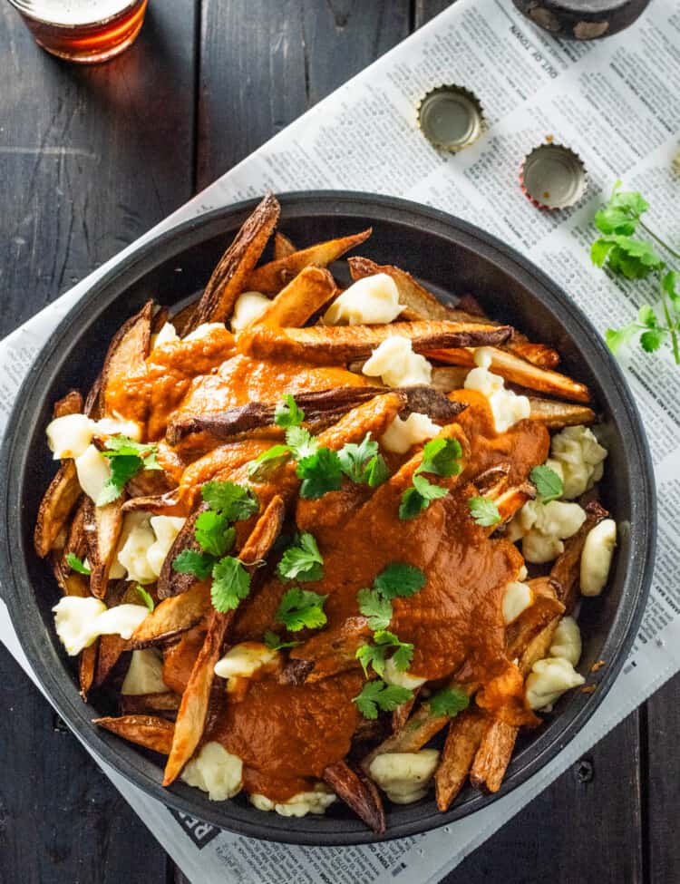 a big bowl of Butter Chicken Poutine