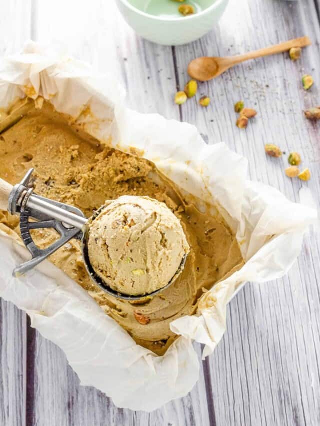 Black Pepper Ice Cream in a freezer dish with an ice cream scoop