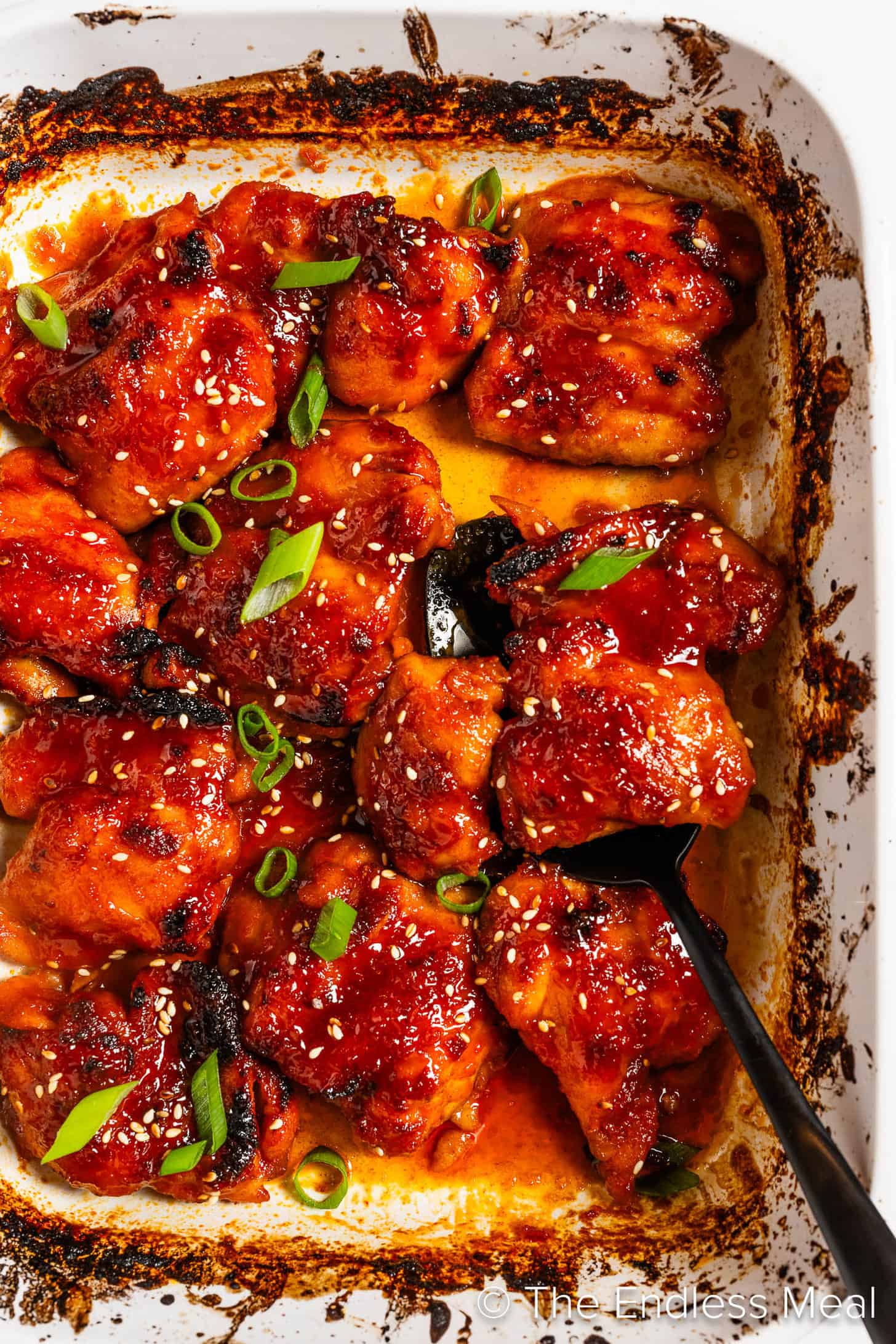 A close up of Korean Chicken Thighs in a baking dish