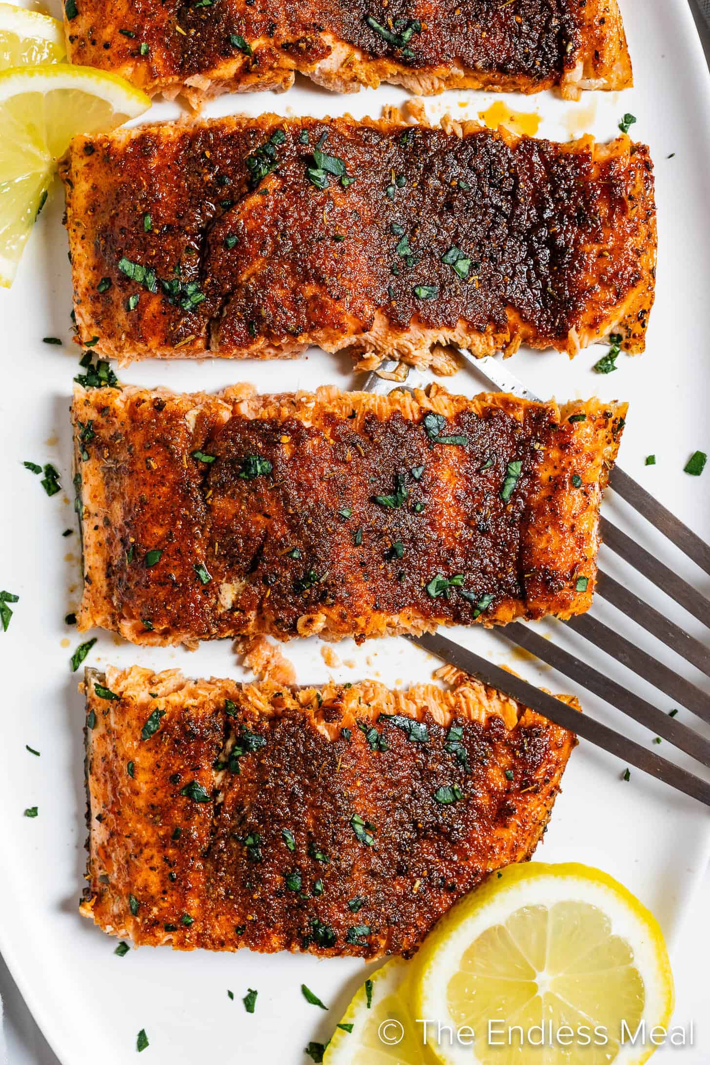 Paprika Salmon fillets on a dinner serving plate.