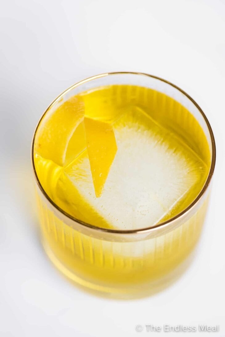a white negroni in a cocktail glass