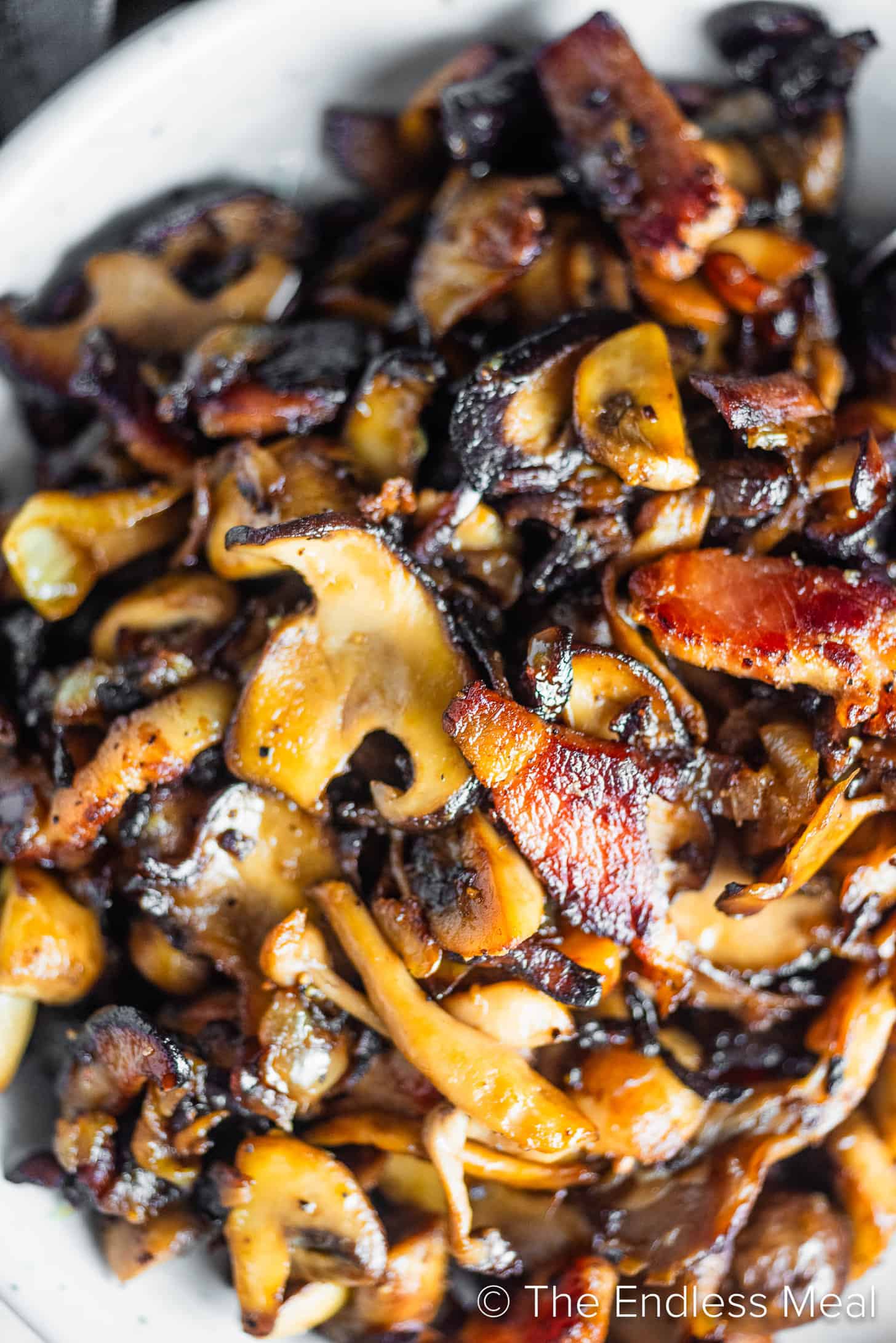 A close up of Bacon Mushrooms in a serving bowl