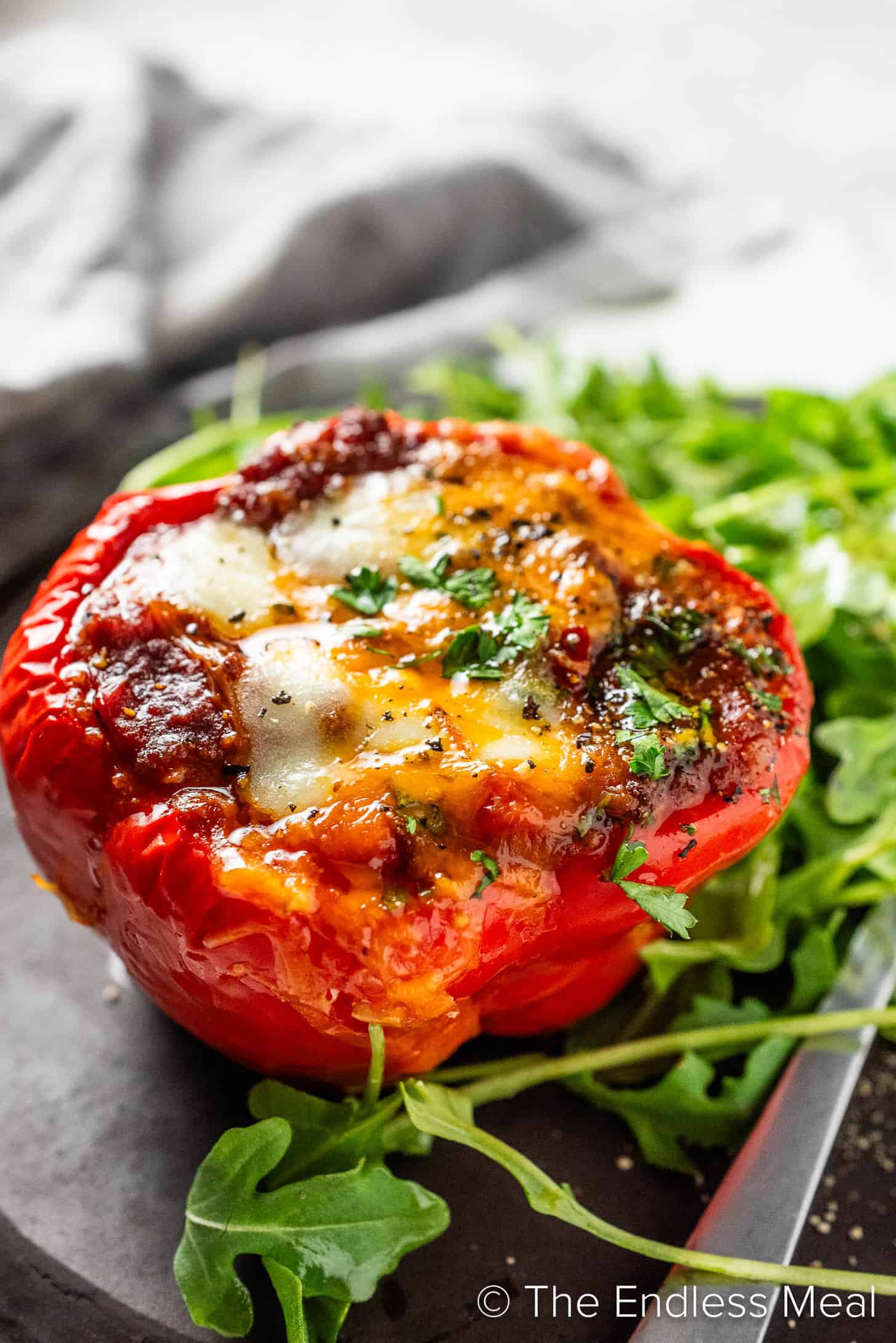 A Chili Stuffed Pepper on a dinner plate