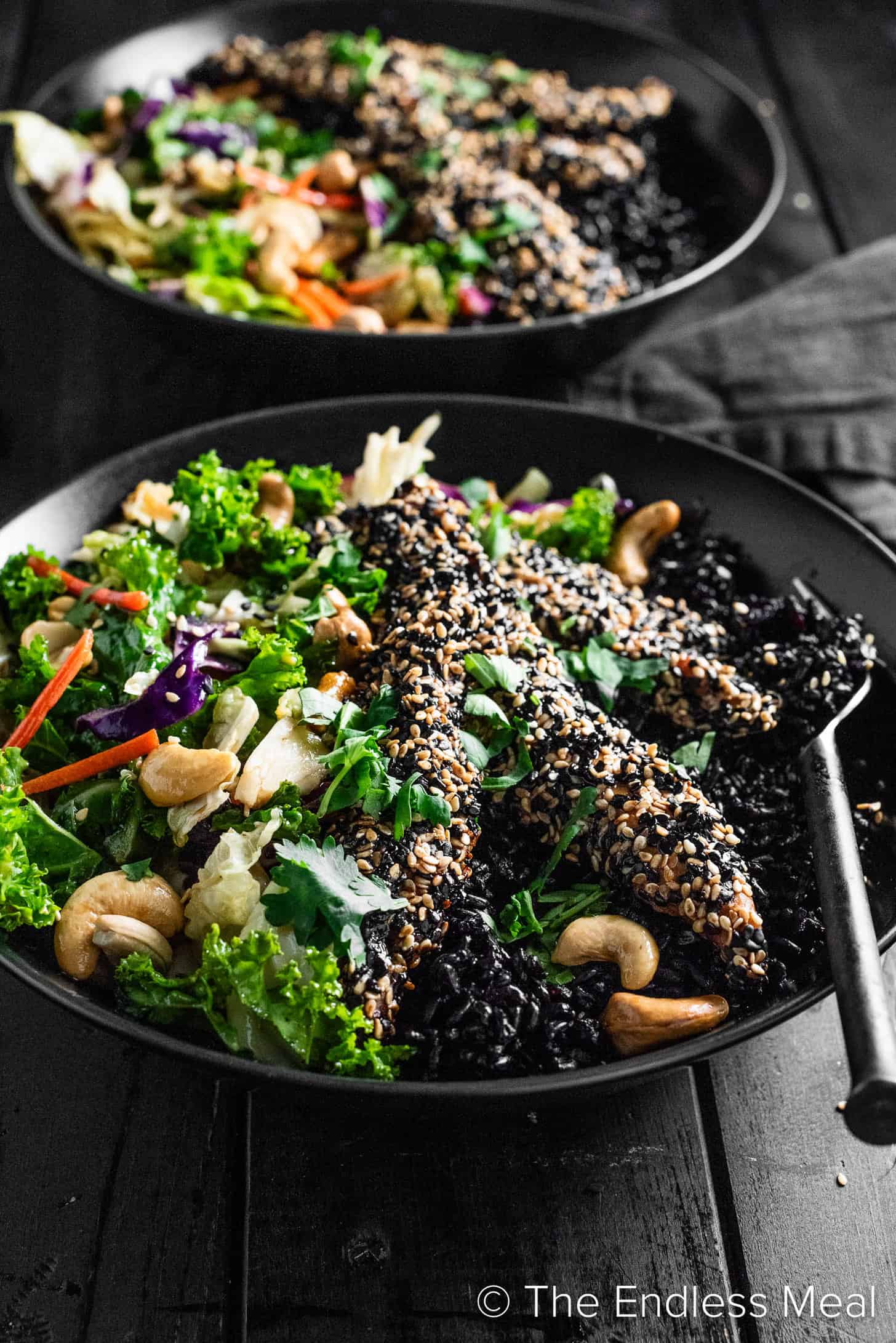 A Sesame Chicken Bowl with salad.