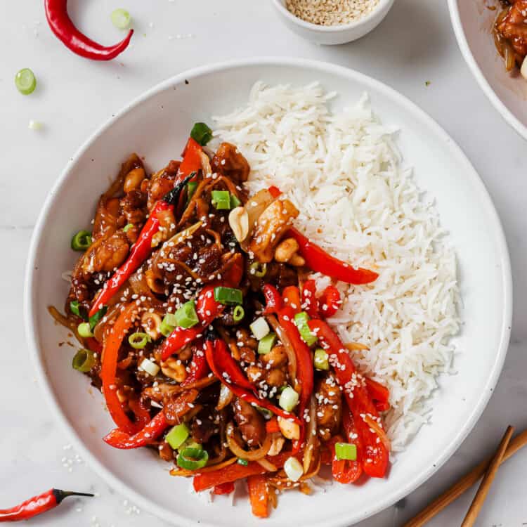 Spicy Kung Pao Chicken on a bowl on the dinner table.