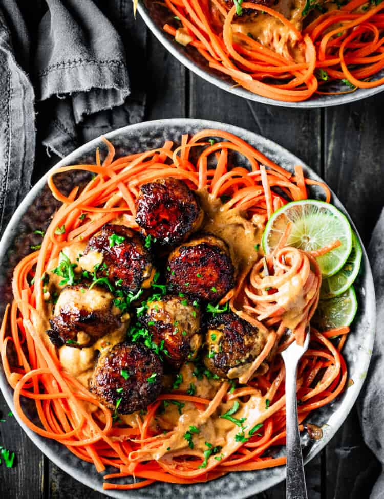 Thai Curry Meatballs with carrot noodles on the dinner table