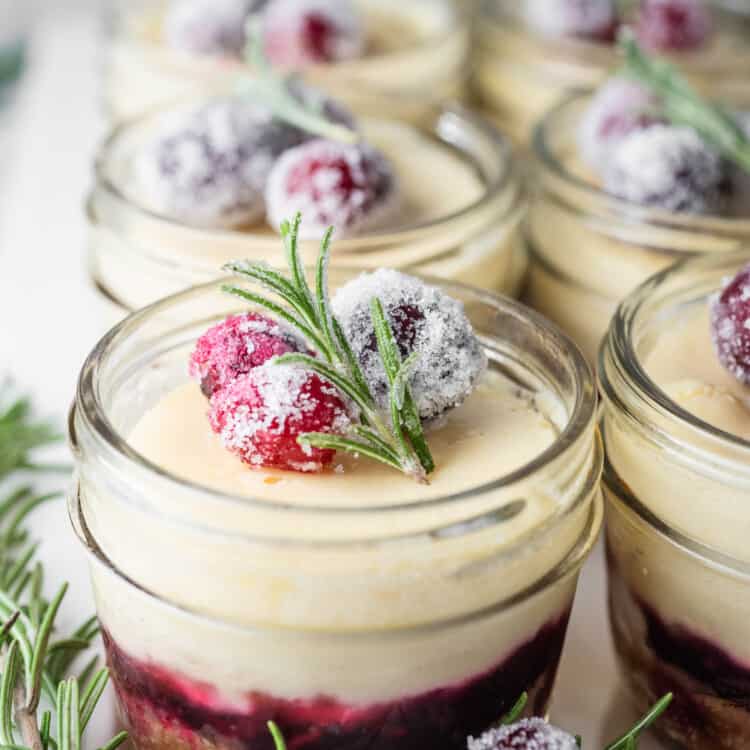 White Chocolate Cranberry Cheesecakes on a dessert tray