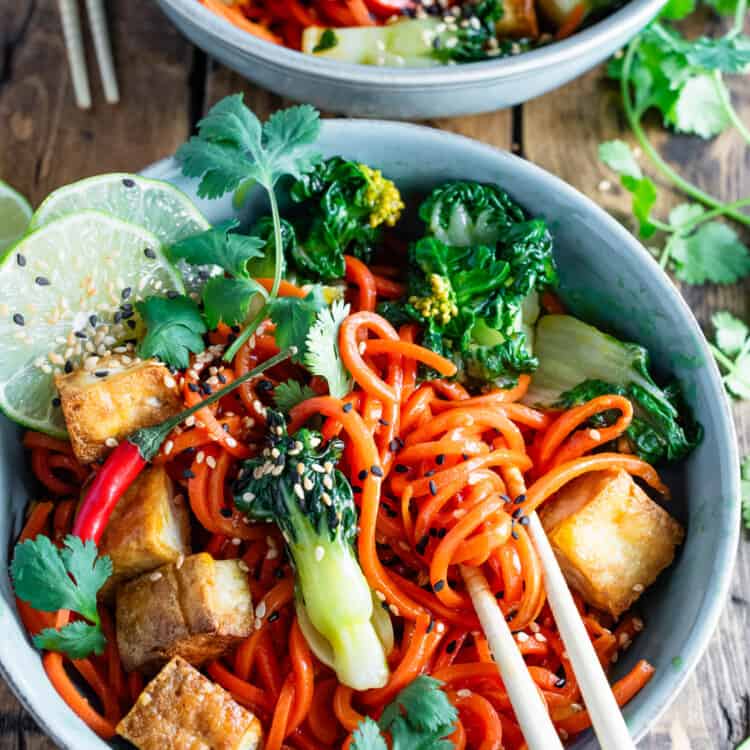 Carrot Noodle Stir Fry in a bowl with chop sticks