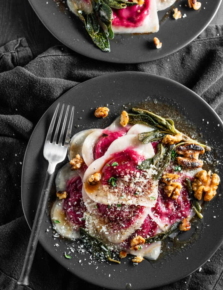 Beet and Goat Cheese Ravioli on a black dinner plate