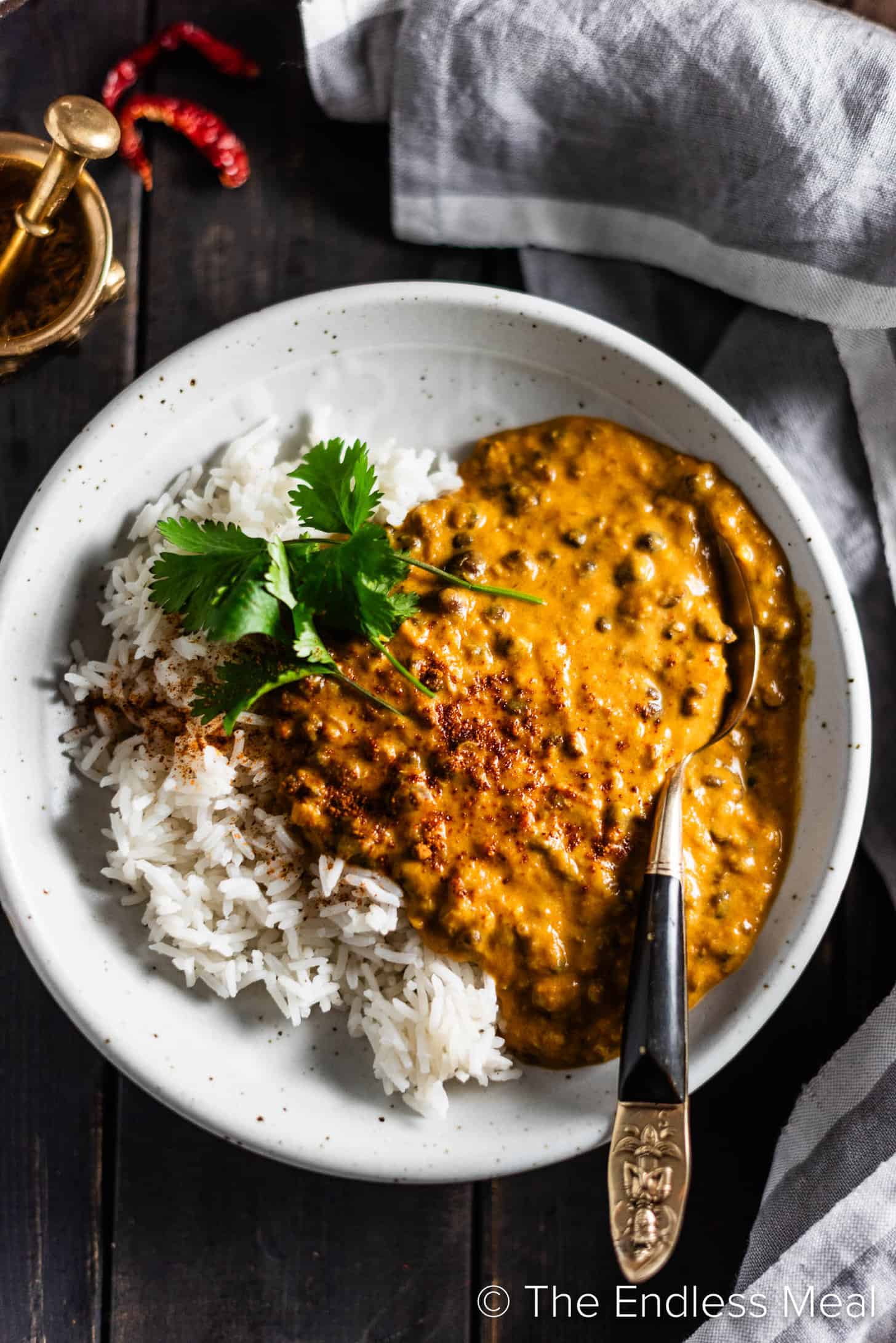 A bowl of Black Lentil Curry with rice