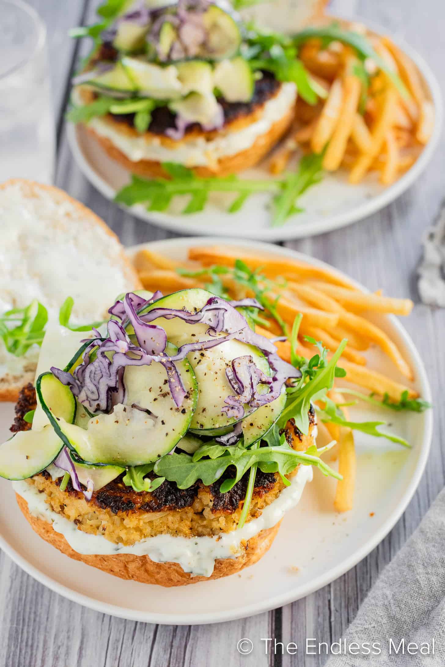 Cauliflower Burgers on a dinner plate with fries