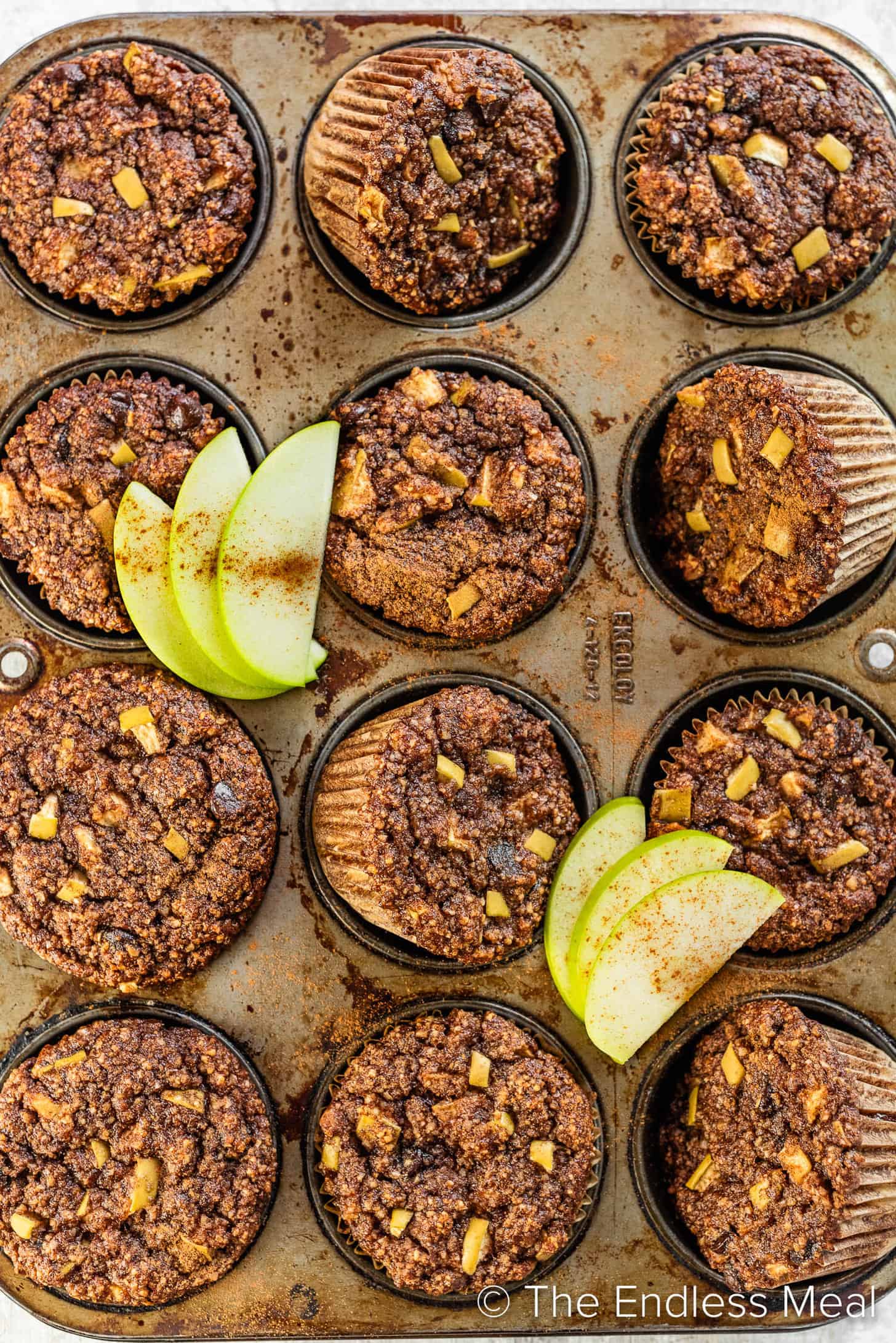 Paleo Apple Muffins in a muffin tin.