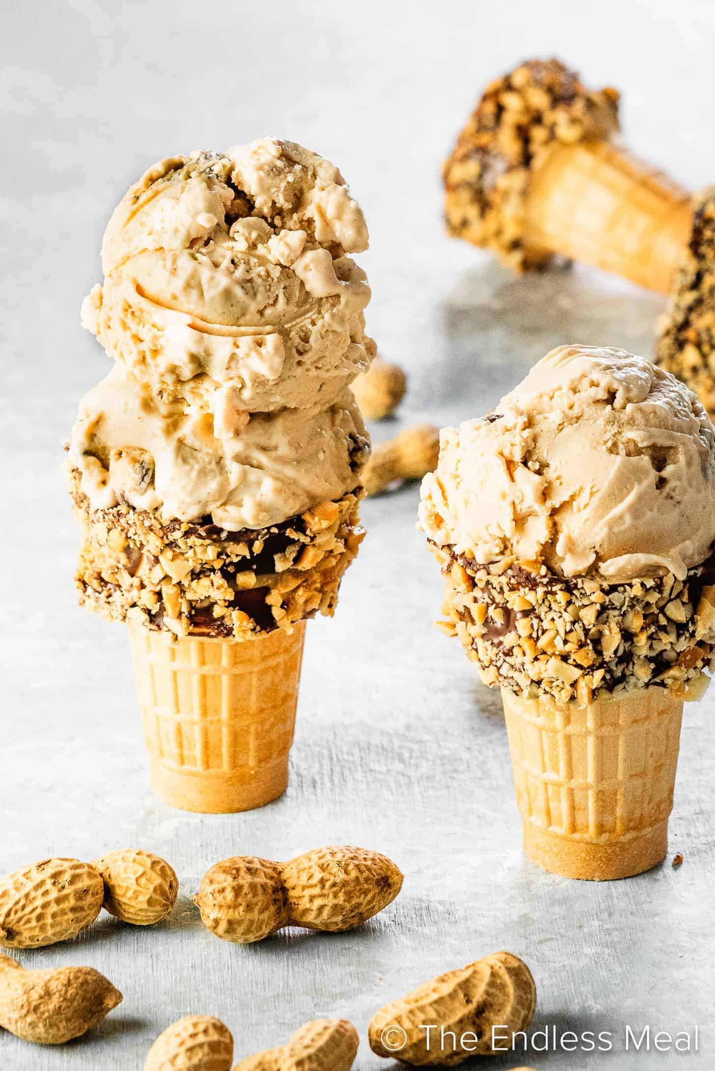 Two ice cream cones with Peanut Butter Cookie Dough Ice Cream