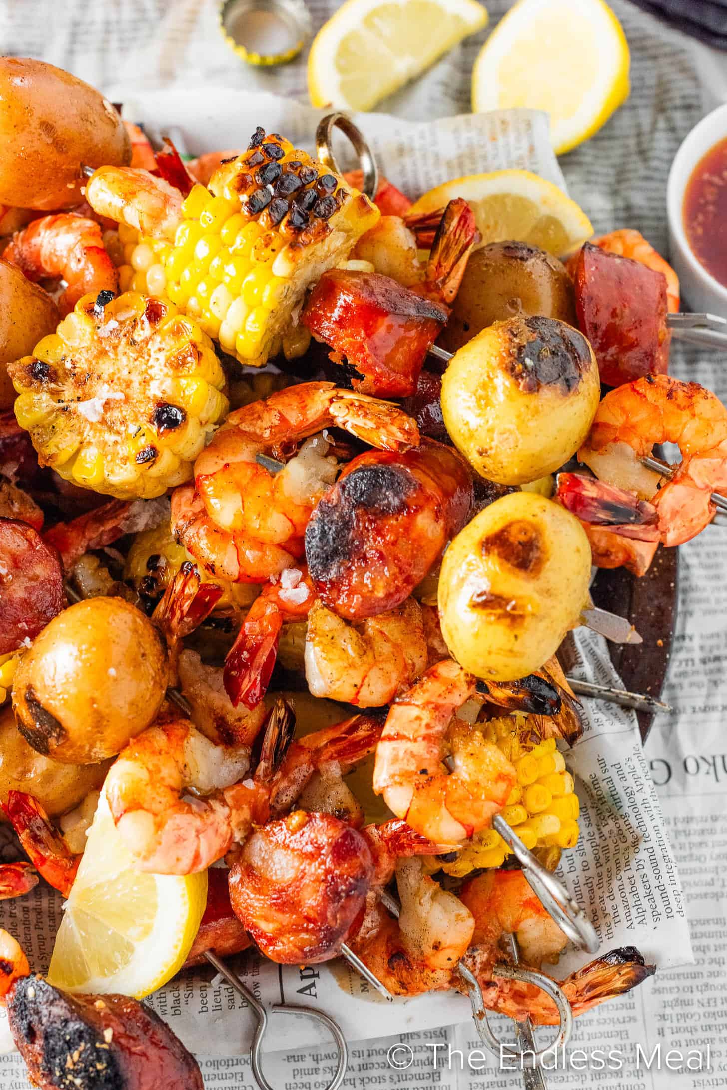 A close up of Shrimp Boil Skewers with corn and sausages