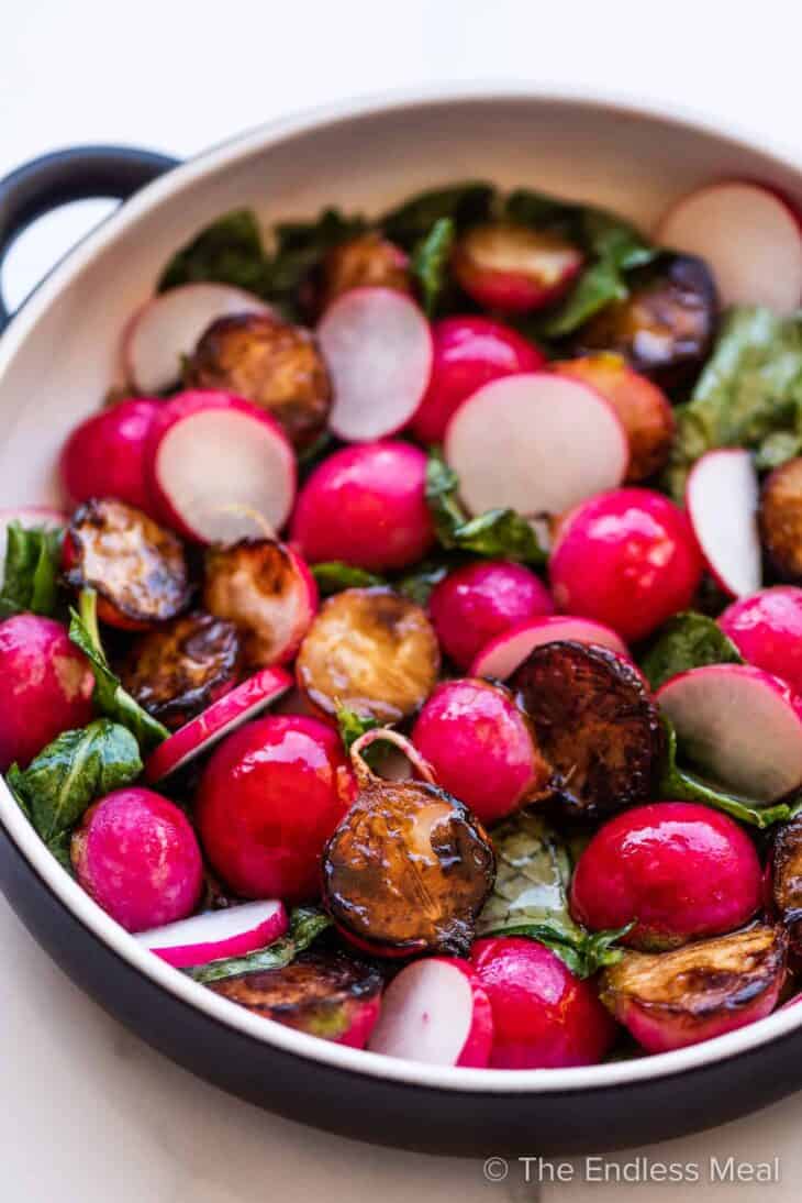 a pan of sauteed radishes