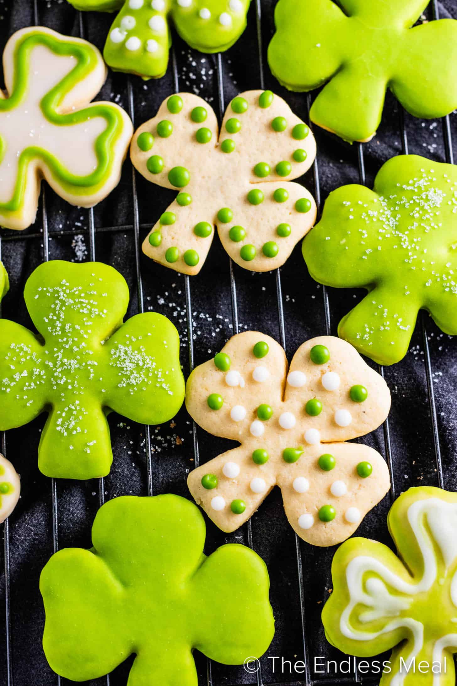 A close up of frosted Shamrock Sugar Cookies