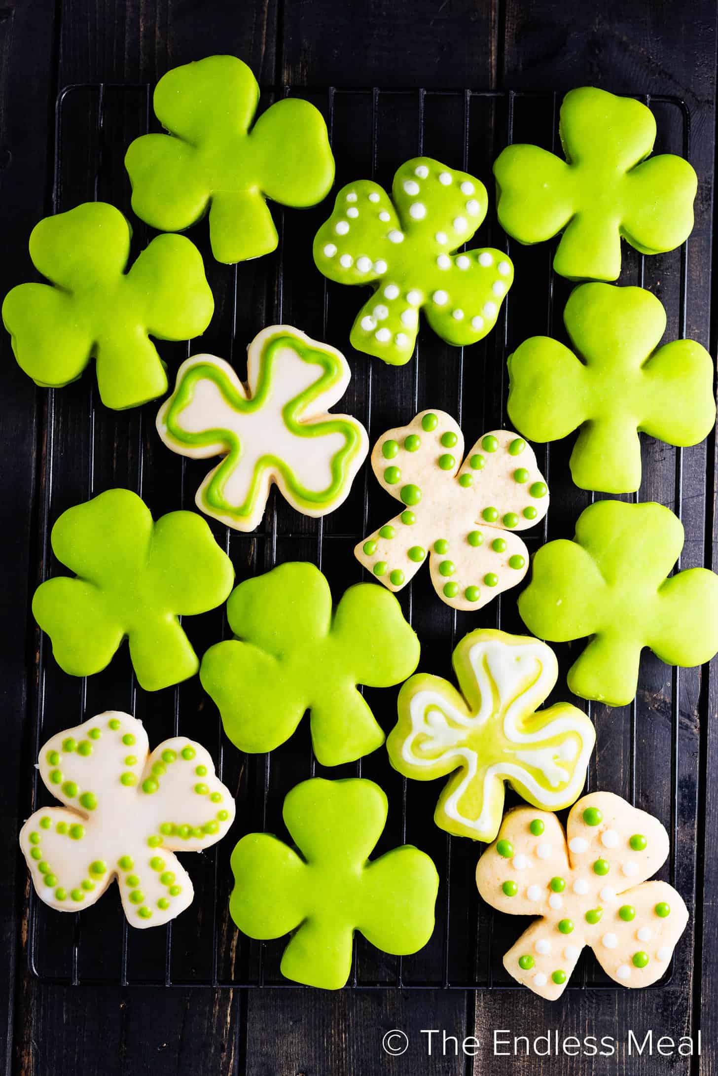 Shamrock Sugar Cookies decorated in green on a dessert table