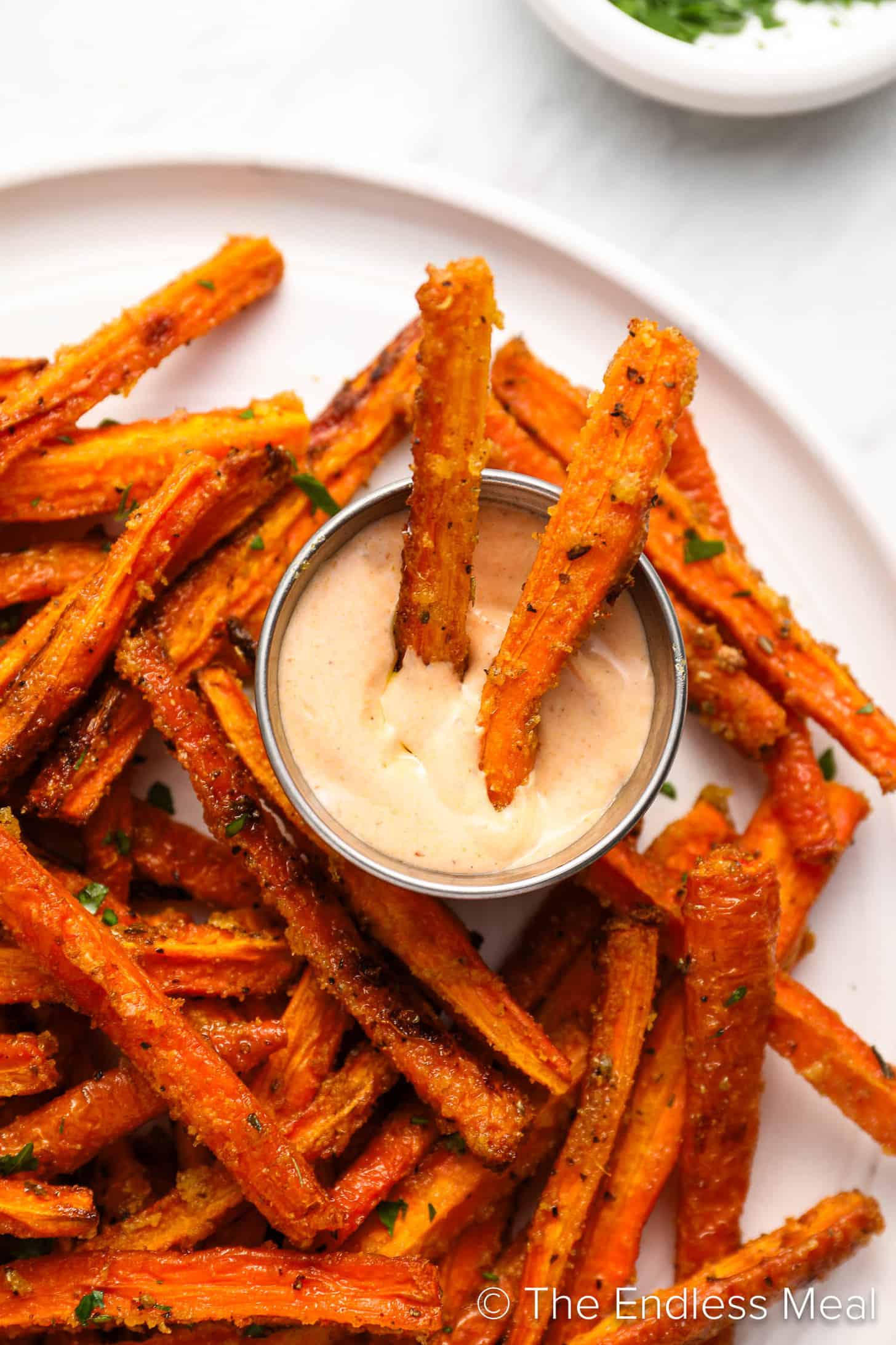 Carrot Fries being dipped into mayo
