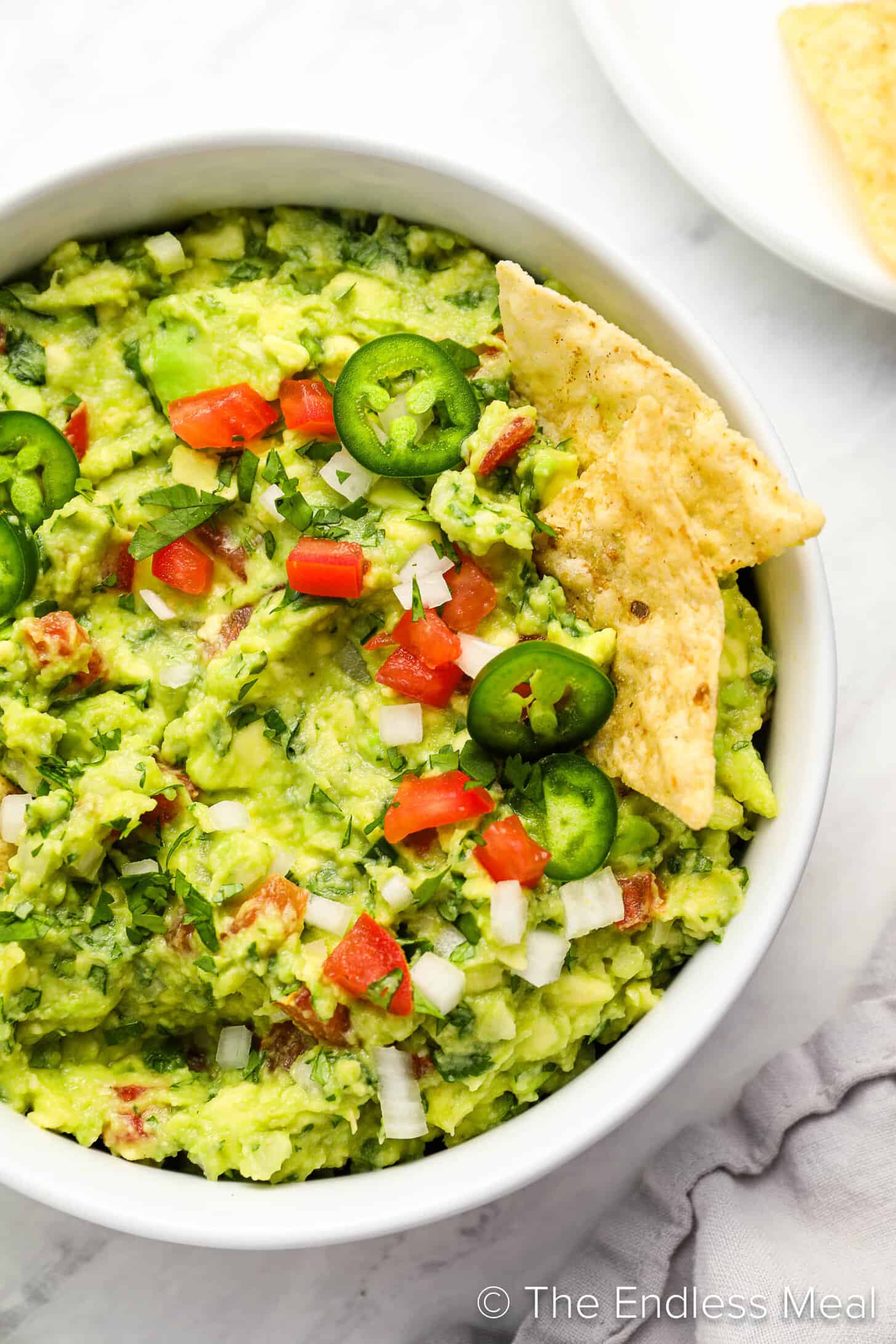 A close up of a bowl of this Easy Guacamole Recipe