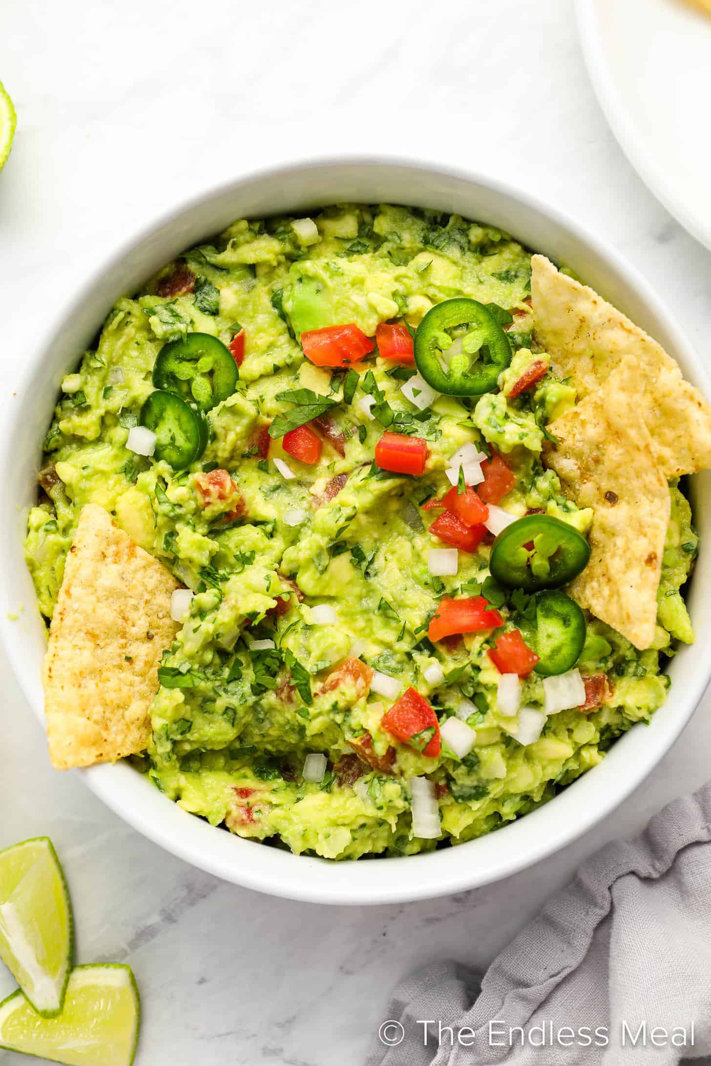 Easy Guacamole Recipe in a serving bowl with tortilla chips