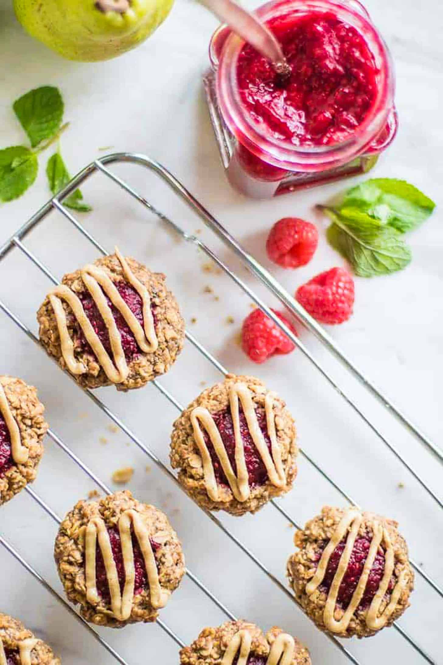 Almond Butter Thumbprint Cookies on a cooling rack.