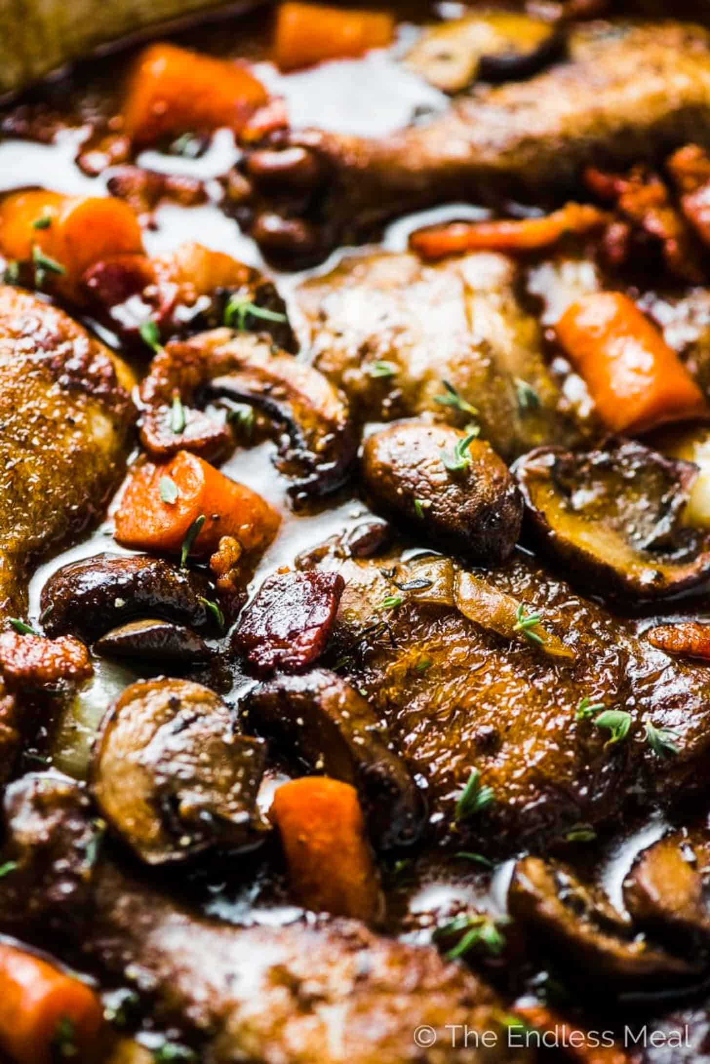 A close up of Coq au Vin in a pan