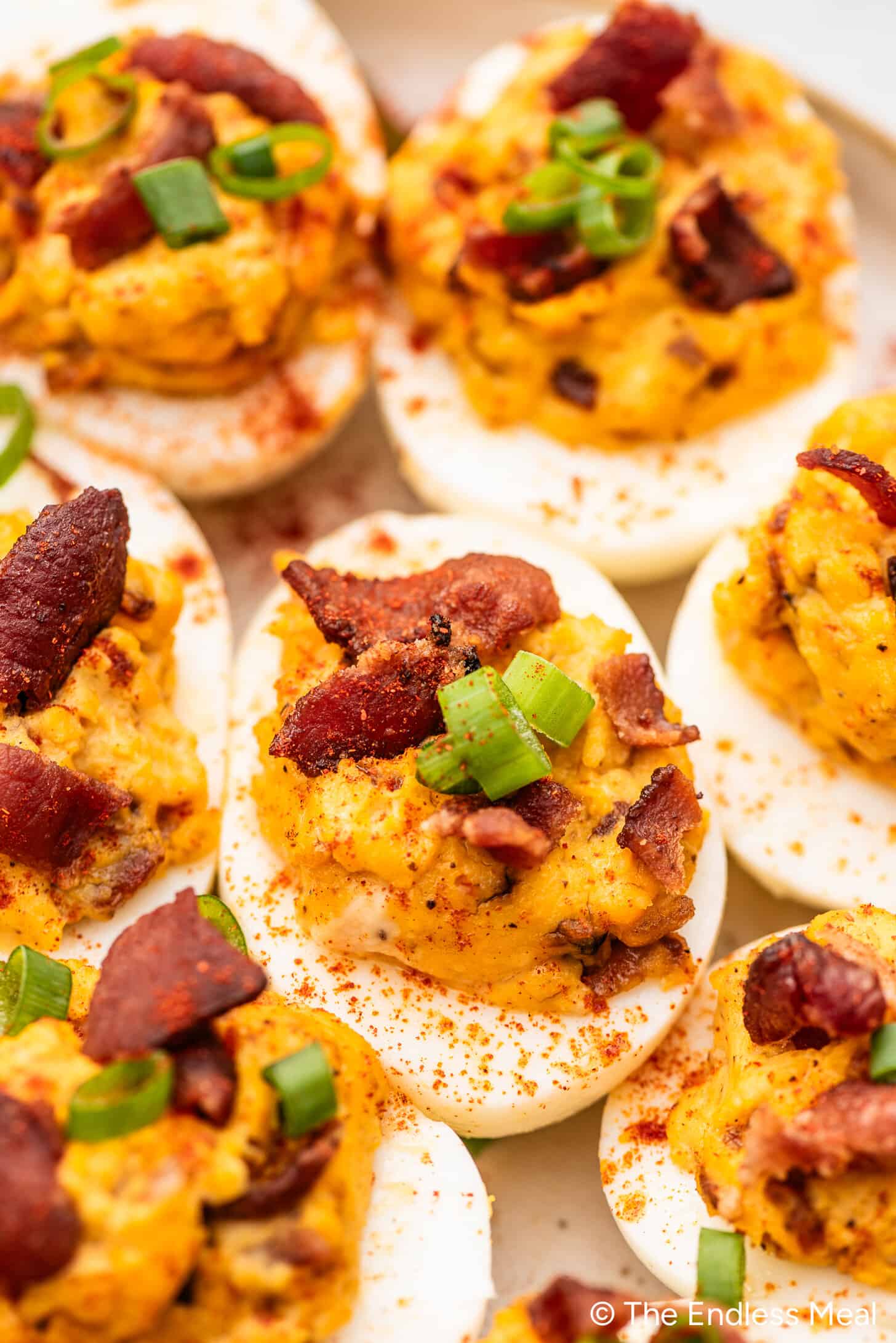 A close up of Deviled Eggs with Bacon on a plate
