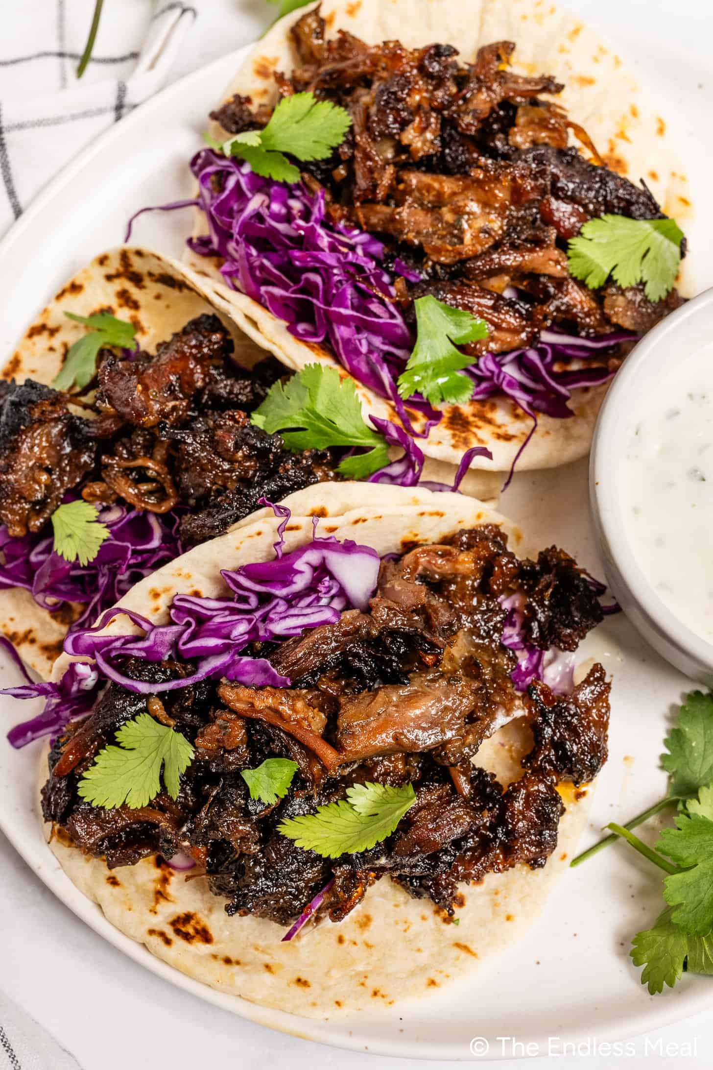 Oxtail Tacos on a dinner plate