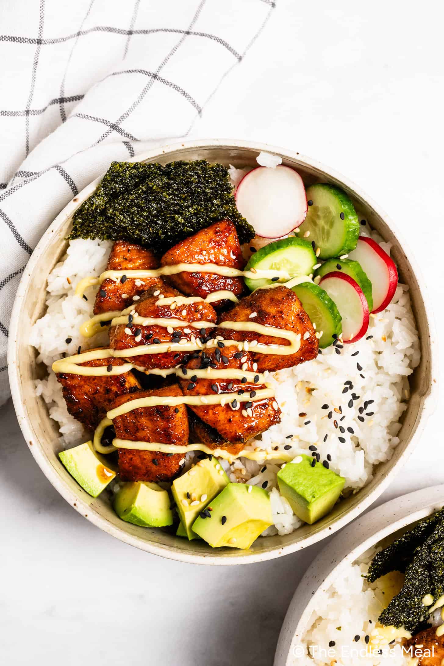 A bowl of Salmon and Rice with avocado and wasabi mayo