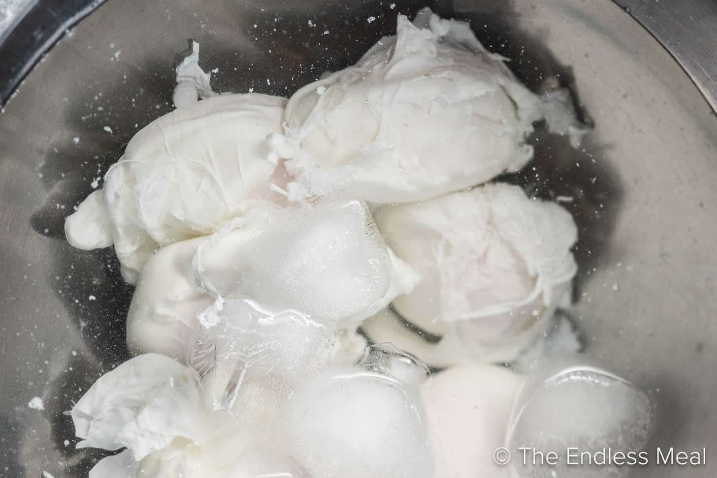 poached eggs in an ice bath