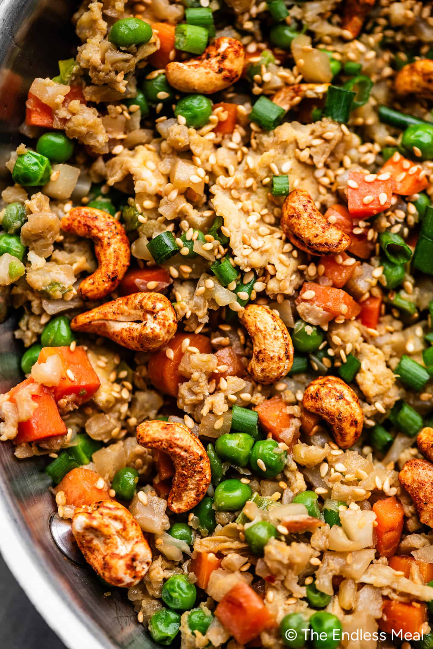 A close up of making Paleo Fried Rice in a frying pan.