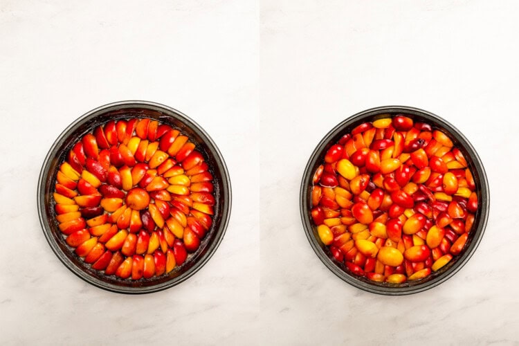 Image for recipe instruction: Two round baking pans for Upside Down Plum Cake, one with sliced red and yellow plumcots arranged neatly, the other with plums scattered, set on a white marble surface.