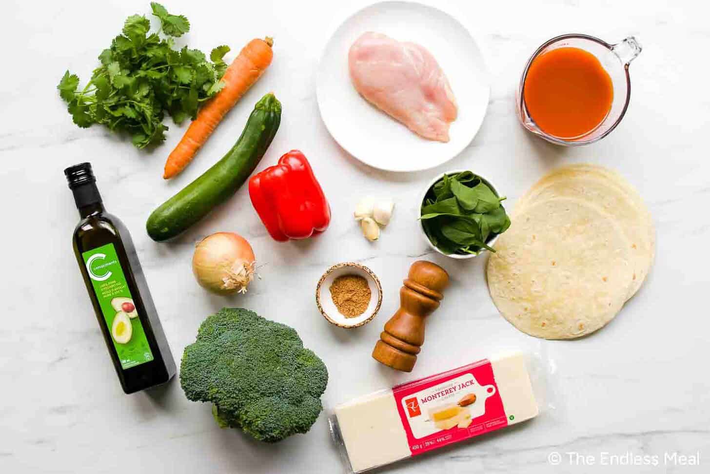 the ingredients needed to make chicken vegetable enchiladas