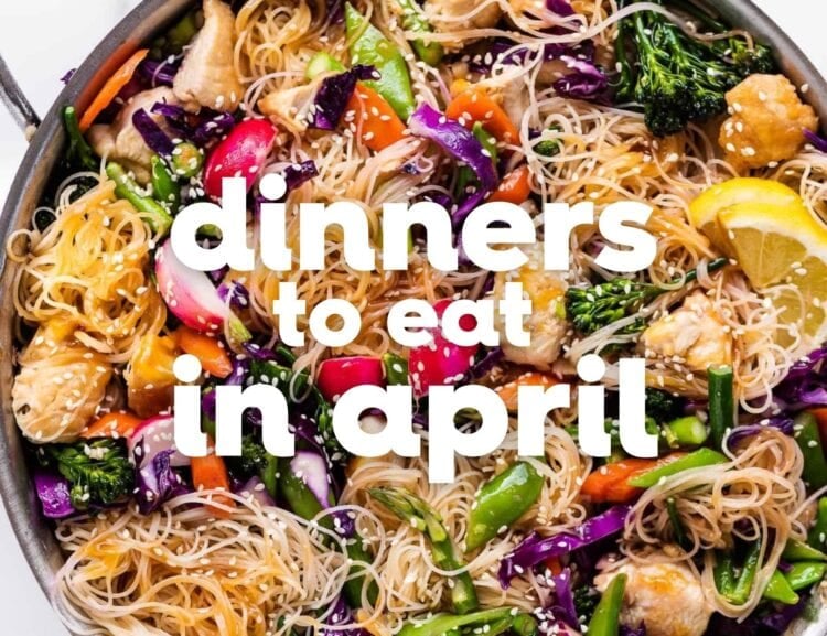 A stainless steel pan filled with stir-fried noodles, vegetables, and chicken, with the text “April dinners to eat” overlaid on top—perfect inspiration for quick and tasty spring recipes.