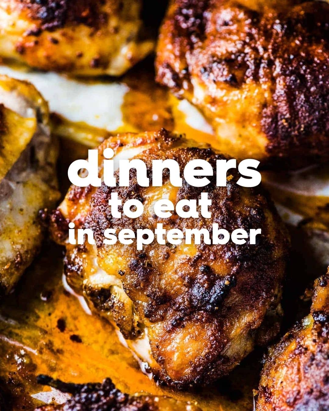 Close-up of seasoned, roasted chicken pieces with text overlay that reads delicious dinners to eat in September.