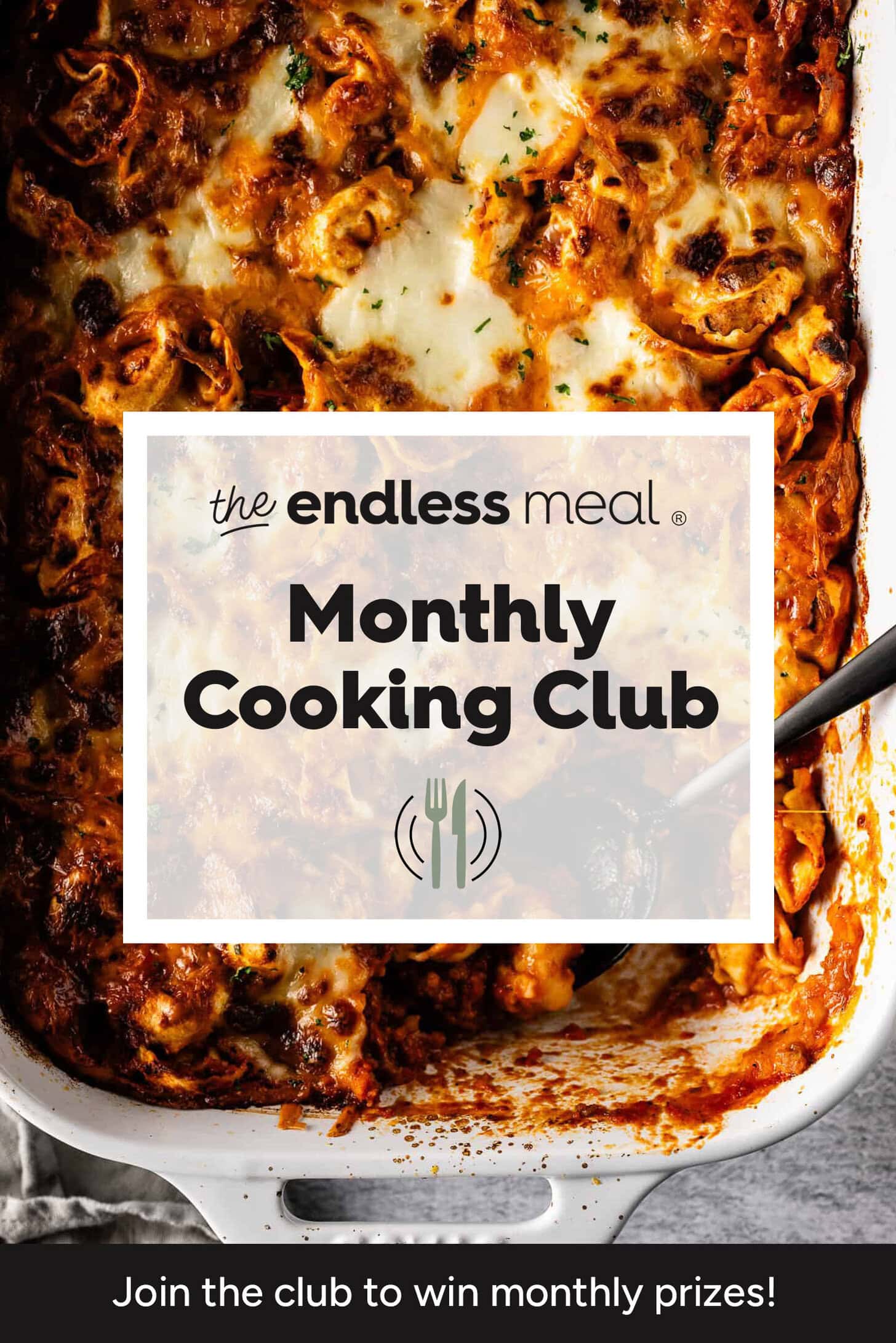 A baked pasta dish in a white pan with a serving spoon, overlaid with text: The Endless Meal Monthly Cooking Club. Join the club to win monthly prizes!.